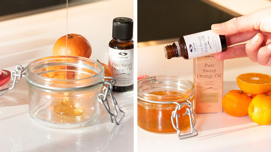 Pure Orange Oil ECO is poured into a jar of honey.